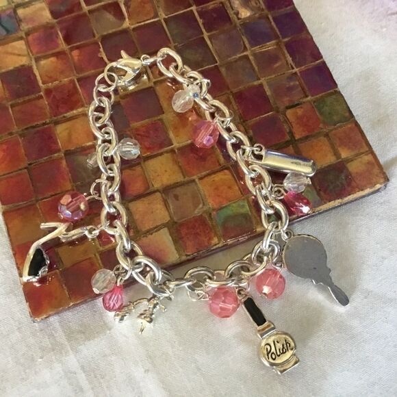$12 ea of 3/$25. Silvertone “Girly” Charm Bracelet - Picture 3 of 7